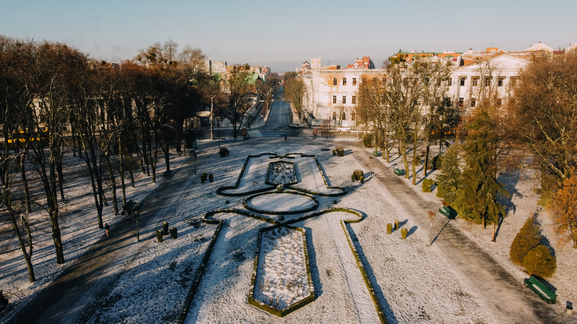 European town Poltava in Ukraine. Snowy central park of the city, land design, old cadet corp